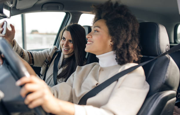 istock Three female friends in the car 1064476648