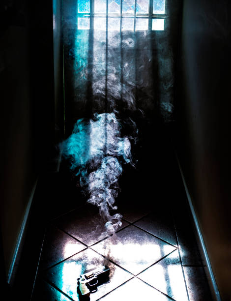 istock Smoking gun on the foor 1064477696