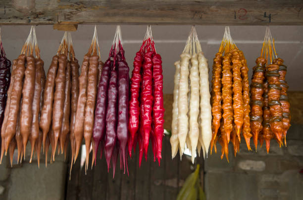 istock Churchkhela,  Sweet sujukh - nuts covered with grape or pomegranate juice 1064483392