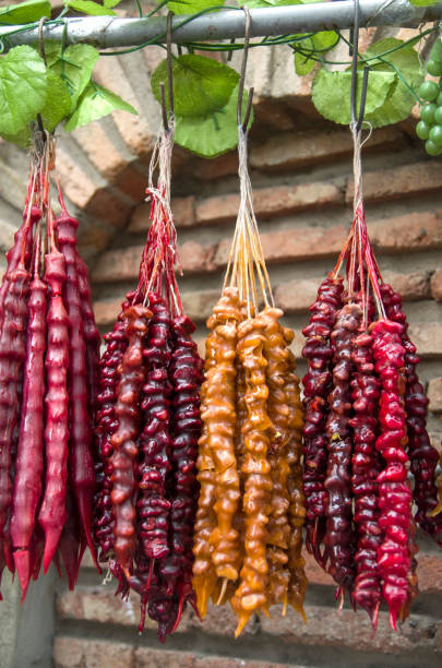 istock Churchkhela,  Sweet sujukh - nuts covered with grape or pomegranate juice 1064483398