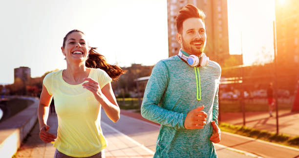 istock Couple jogging outdoors 1064483654