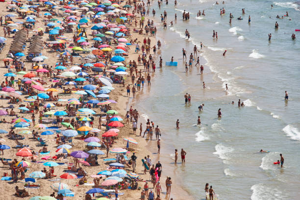 istock Mediterranean coastline in Spain. Calpe beach. Summer crowd. Alicante 1064484028