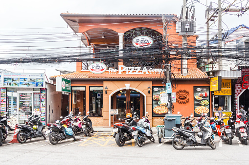 Patong, Thailand - 9th August 2018: The Pizza Company restaurant. The eating place is part of a chain serving and delivering pizzas.