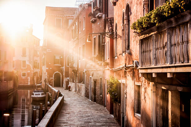 istock Venice alley with beautiful light at sunset 1064490786