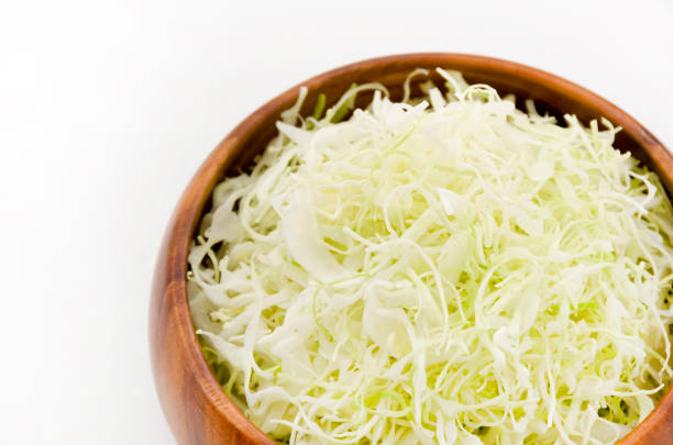 istock Shredded Cabbage in a wooden round bowl 1064493356