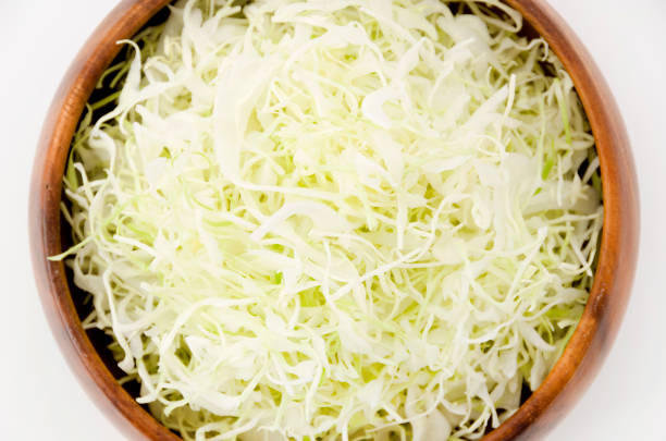 istock Shredded Cabbage in a wooden round bowl 1064493386