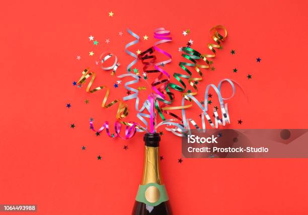 Champagne Bottle With Colorful Streamers Top View Stock Photo - Download Image Now - Champagne, Celebratory Toast, Congratulating