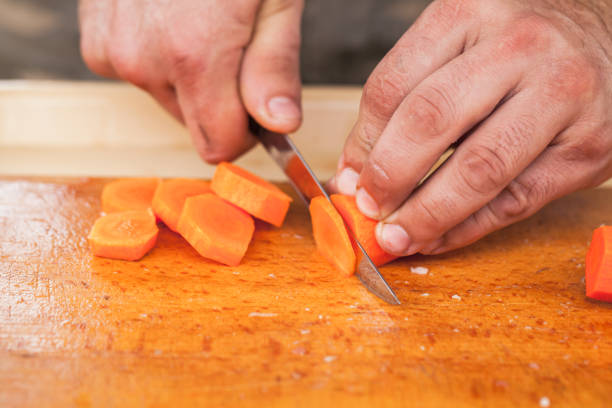 istock Greens slicing. Hands of cook with knife 1064504792