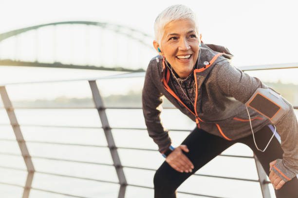 istock Joyful senior woman stretching 1064507596