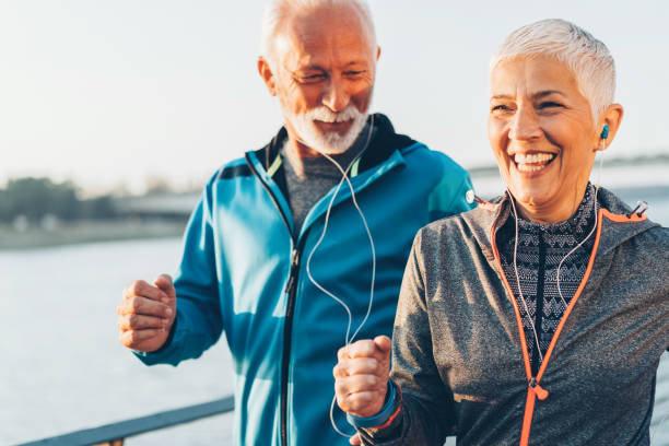 istock Senior couple jogging together 1064507614