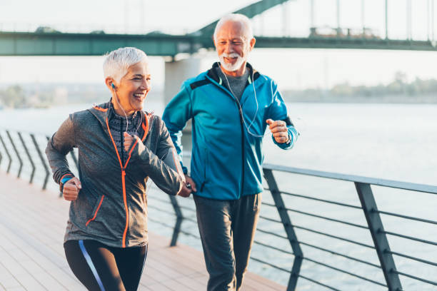 istock Senior couple jogging together 1064507636