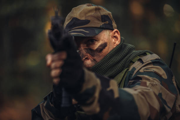 istock Military soldier shooting a weapon 1064511862