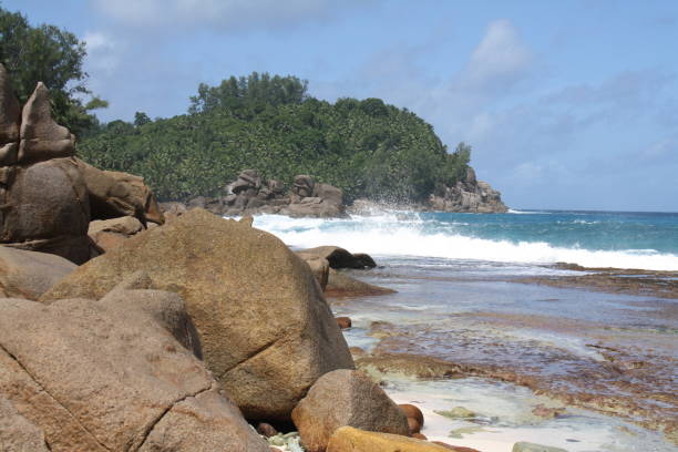 istock Surf on a deserted beach, Seychelles 1064511868