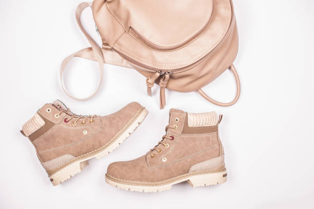 Beige Woman Boots with Shiny Backpak on White Background