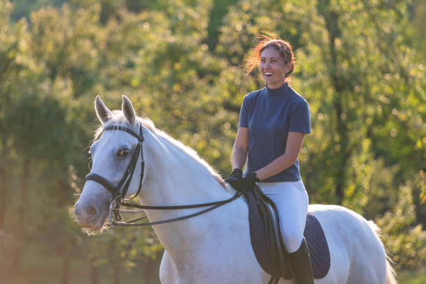 istock Woman riding horse 1064519586