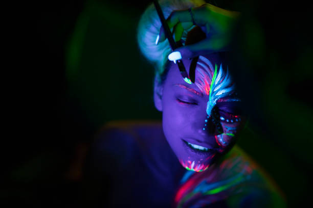 Close-up shot of a body painting process.