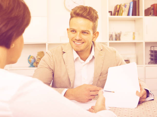 istock man tells woman about interesting offers 1064522462