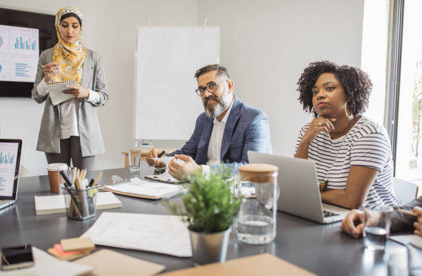 istock Explaining coworkers new business idea 1064530616