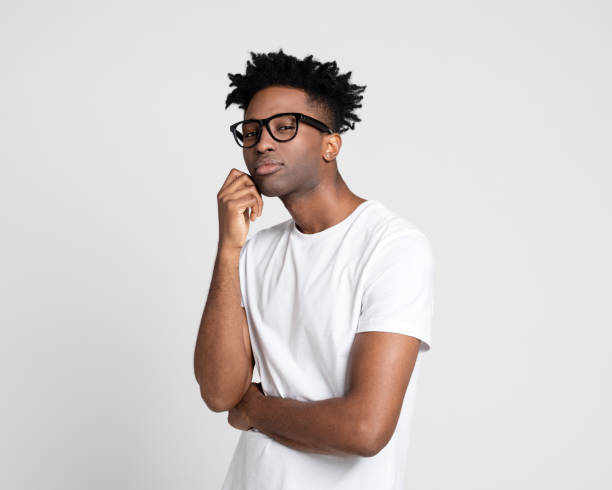 istock Nerdy afro american guy staring at camera 1064530828