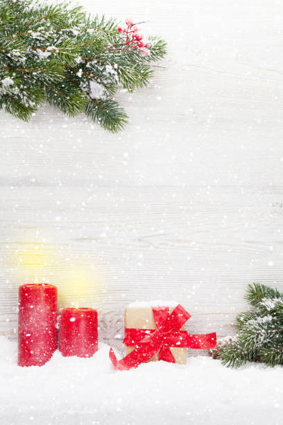 istock Christmas gift box, candles and fir tree 1064530918