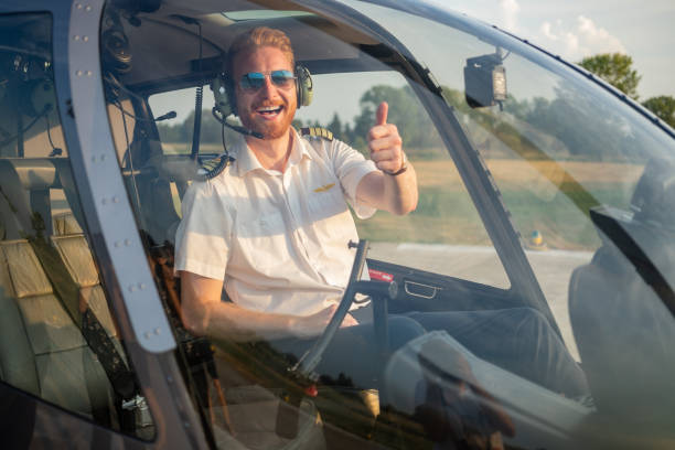 istock Helicopter pilot giving thumbs up 1064531076