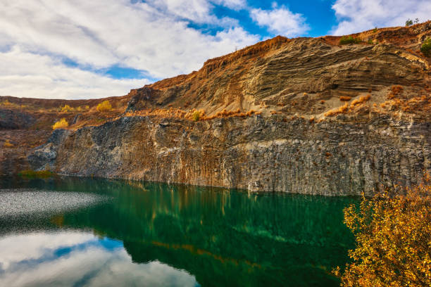 horizontal nature shot of volcanic lake near basalt mountains.