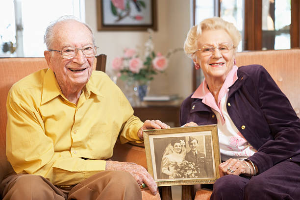 Senior couple holding wedding photo  nursing home photos stock pictures, royalty-free photos & images