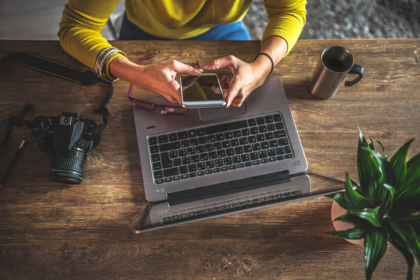 photographers working in their office - professional photographer imagens e fotografias de stock