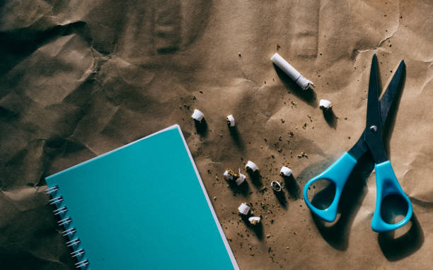 istock scissors, blue notepad, cutted cigarette,world no tobacco day 1064544800