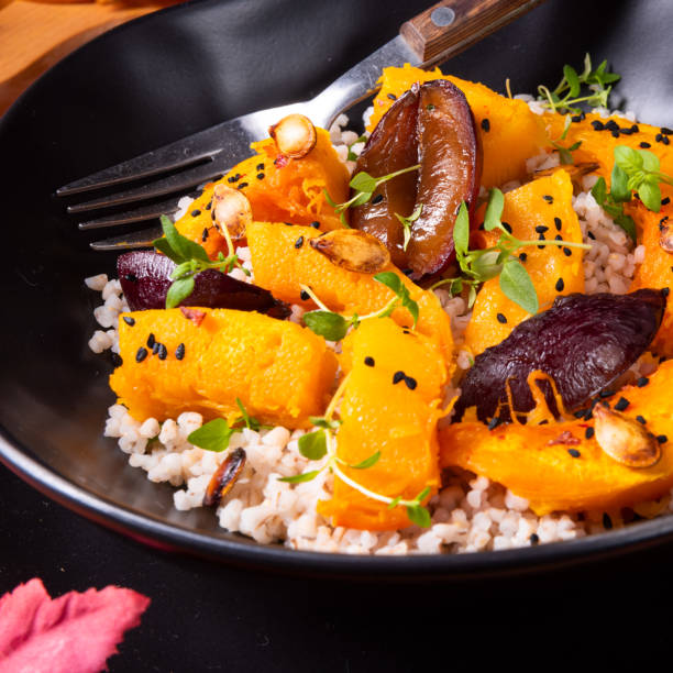 istock gratinated vegetarian pumpkin with barley groats, plums and thyme 1064546524