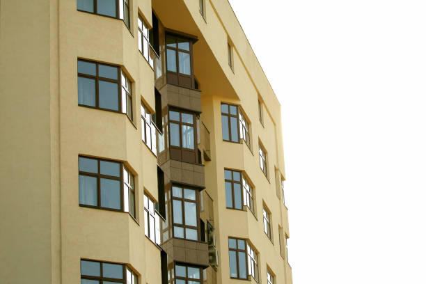istock facade of apartment building against the sky 1064549088
