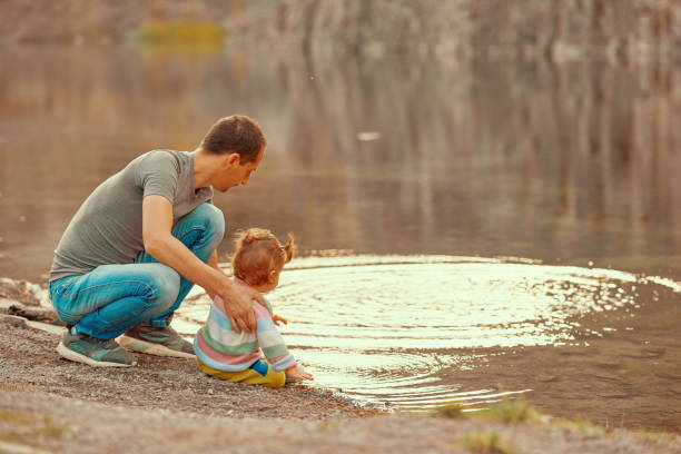 istock enjoy autumn day with her father 1064549450