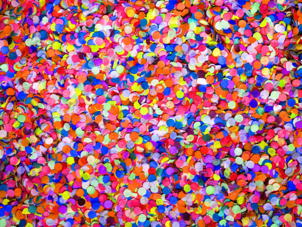 istock Confetti diversity background, large size. Texture colored circles from paper, close-up. Basis for a festive design or a postcard. Carnival, abstract wedding or birthday backdrop 1064549716