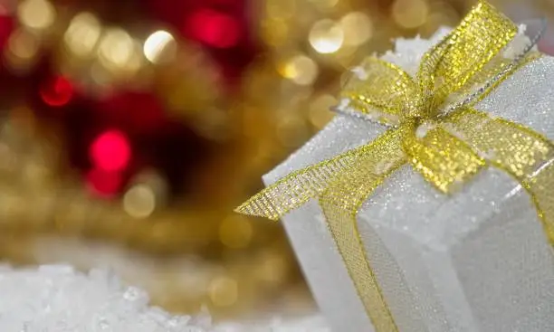 Blurred background light colors with beautiful ornament gift box.