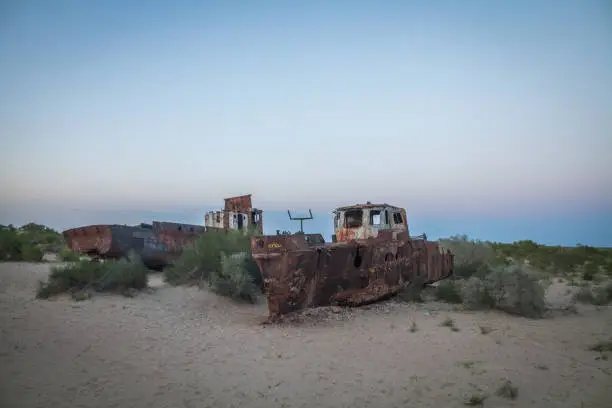 Color image of some wrecked ships, on the former banks of the Aral sea in Moynaq, Uzbekistan.
