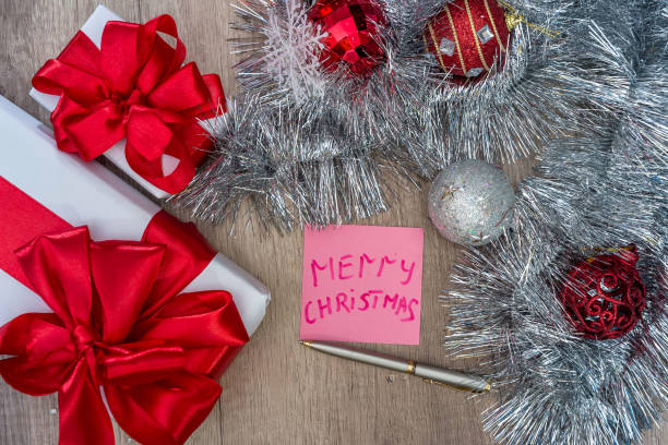 istock Top view of christmas presents with decorations on table 1064552244