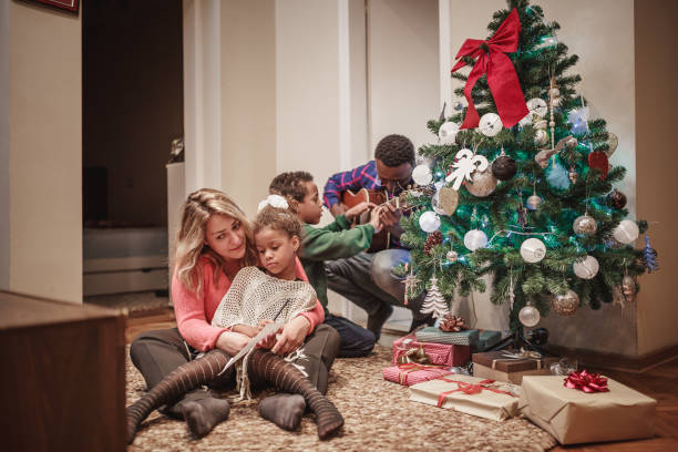 istock Parents with their kids having fun. Its Christmas time. 1064555876