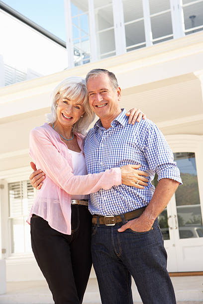 istock Senior Couple Standing Outside Dream Home 106455616