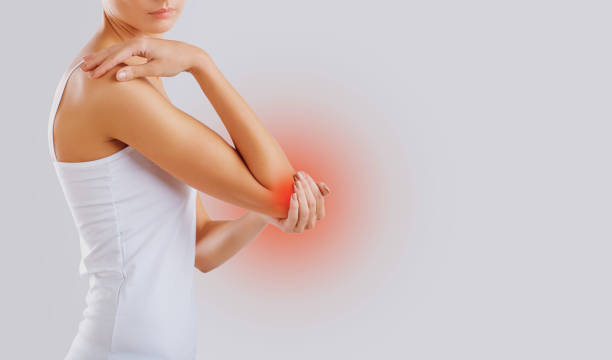 istock Pain, injury in the elbow joint. 1064560840