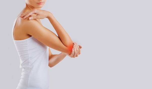 istock Pain, injury in the elbow joint. 1064560844