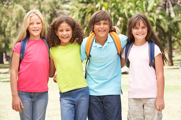 istock Group Of Schoolchildren Standing In Park 106456725