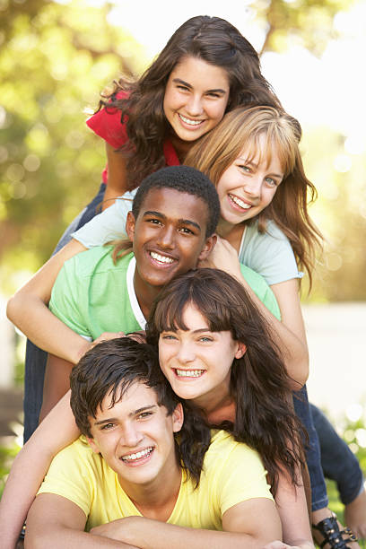 istock Teenagers Piled Up In Park 106456789