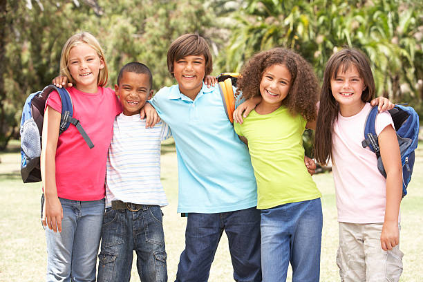 istock Group Of Schoolchildren Standing In Park 106456796