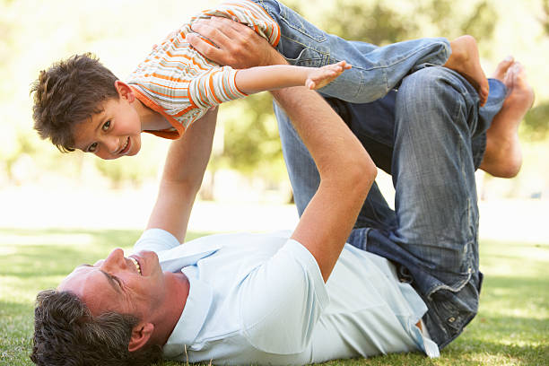 istock Father And Son Playing Together In Park 106456858