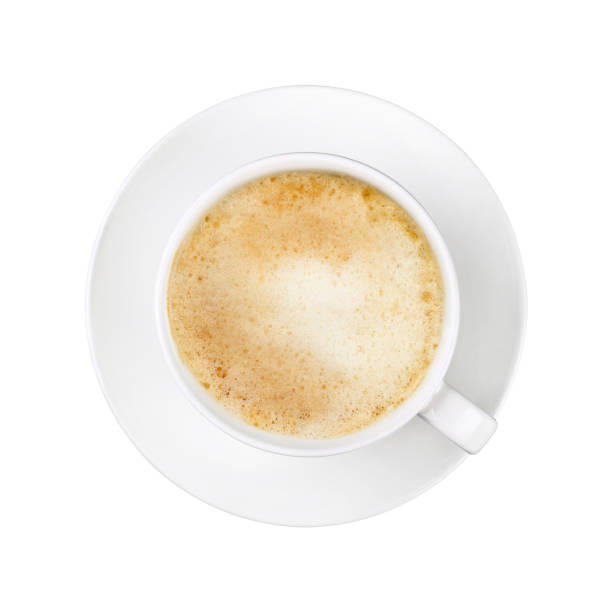 istock White cup of cappuccino coffee on saucer isolated 1064568634