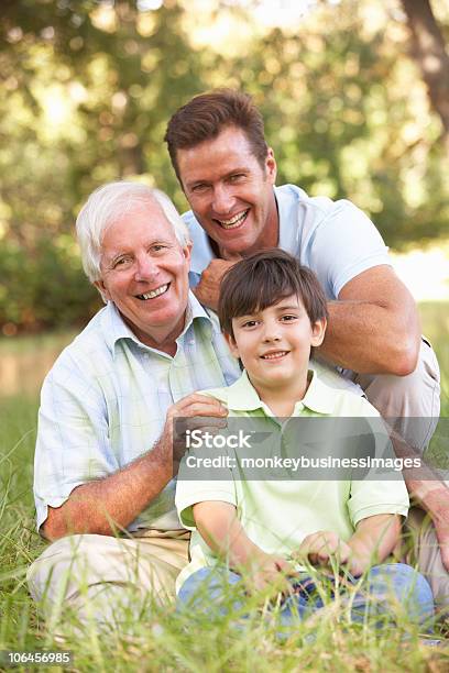 Grandfather With Son And Grandson In Park Stock Photo - Download Image Now - Family, Men, Multi-Generation Family