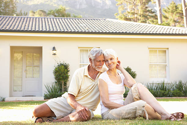 istock Senior Couple sitting Outside Dream Home 106457039