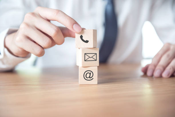 istock CONTACT US, Businessman hand holding ( mail,phone,email ) icon. cutomer support concept 1064570394