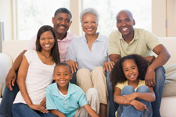 istock Extended family in living room smiling 106457073