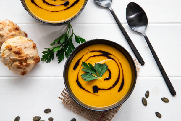 pumpkin soup on a White table stock photo